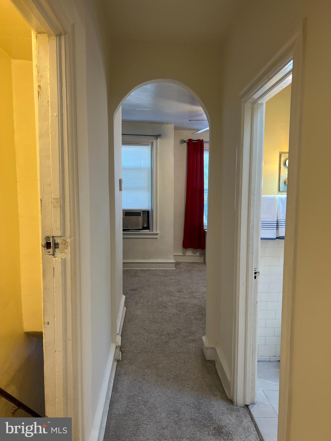 1630 Conlyn Street, Unit 2 Philadelphia, PA 19141 - Photo 4 of 10 a view of hallway with chandelier fan and a door