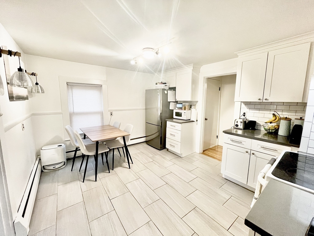 10-12 Edith Avenue, Unit 3 Everett, MA 02149 - Photo 2 of 21 a kitchen with a sink appliances and cabinets