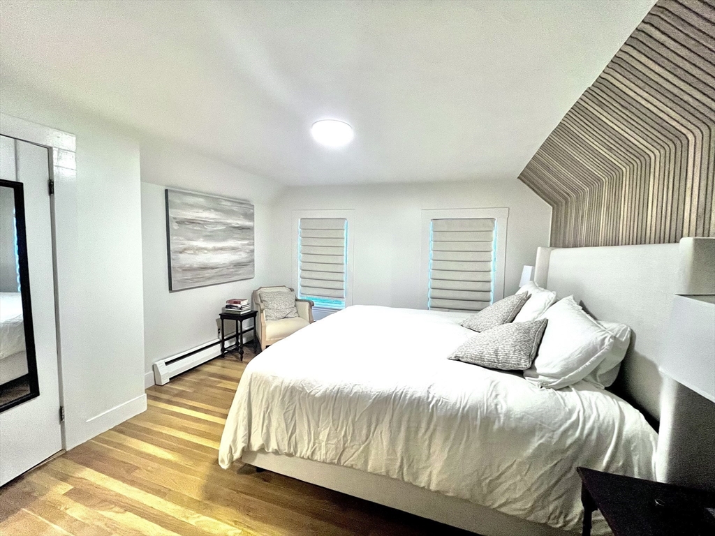 10-12 Edith Avenue, Unit 3 Everett, MA 02149 - Photo 8 of 21 a bedroom with a bed and a window