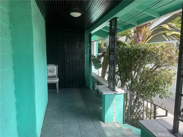 a view of backyard with porch and outdoor seating
