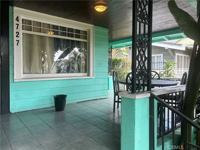 a view of a balcony with a tree