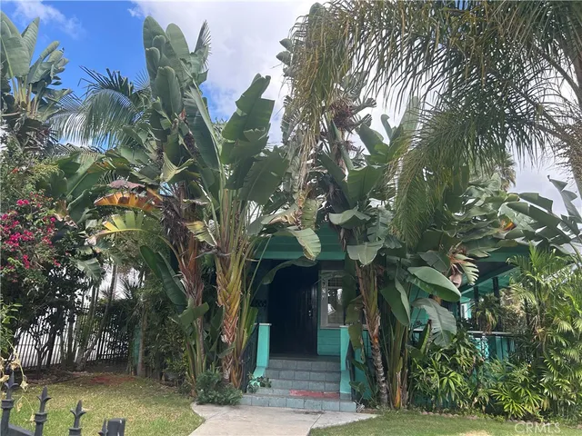 a view of a house with a tree