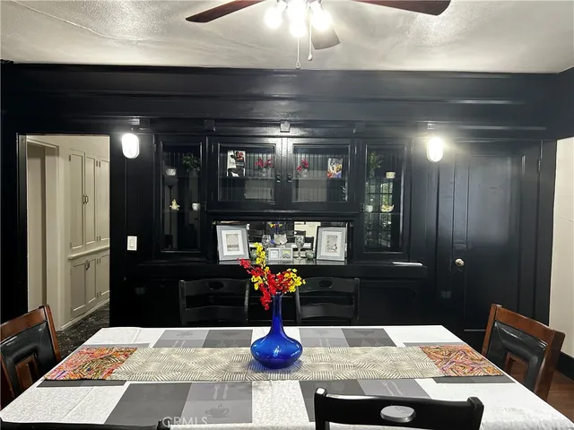 a room with table and mirror