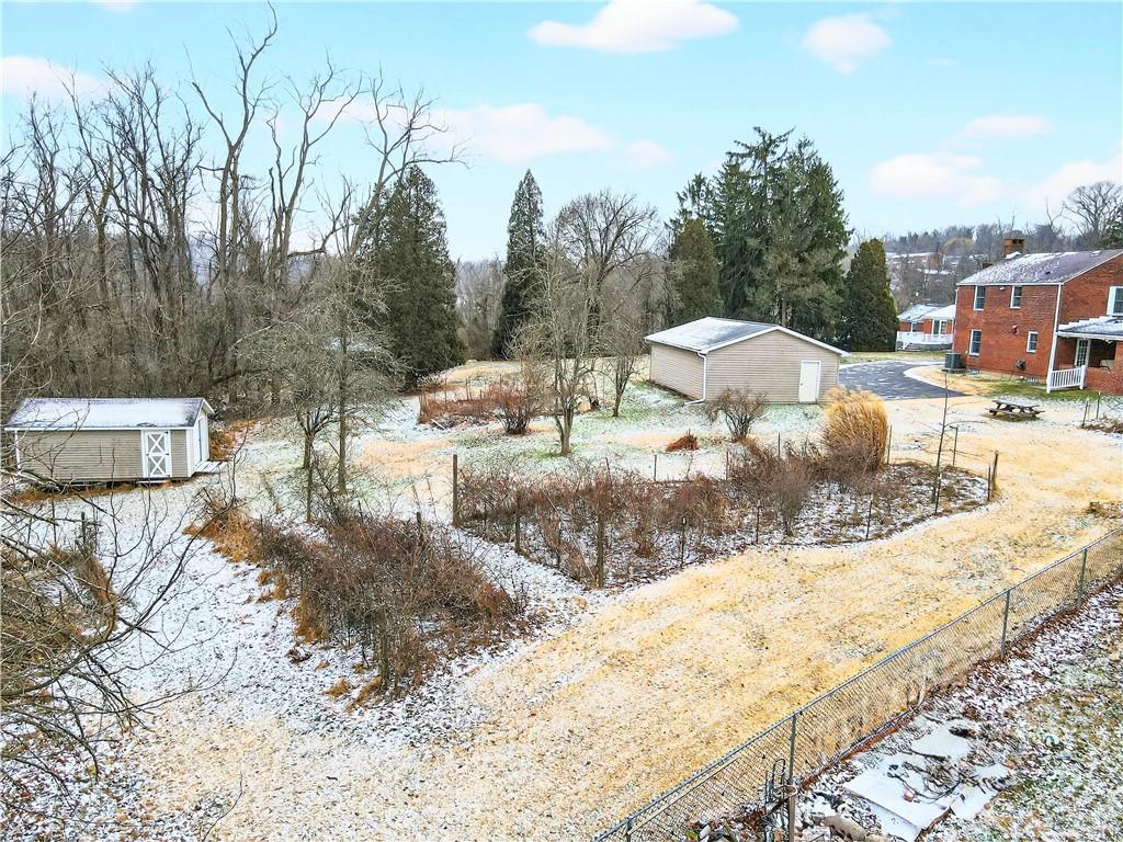 1008 Schweitzer Road McKeesport, PA 15135 - Photo 13 of 43 a view of a dry yard with wooden fence