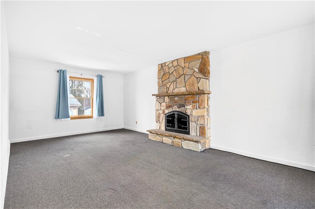 1008 Schweitzer Road McKeesport, PA 15135 - Photo 16 of 43 an empty room with a fireplace