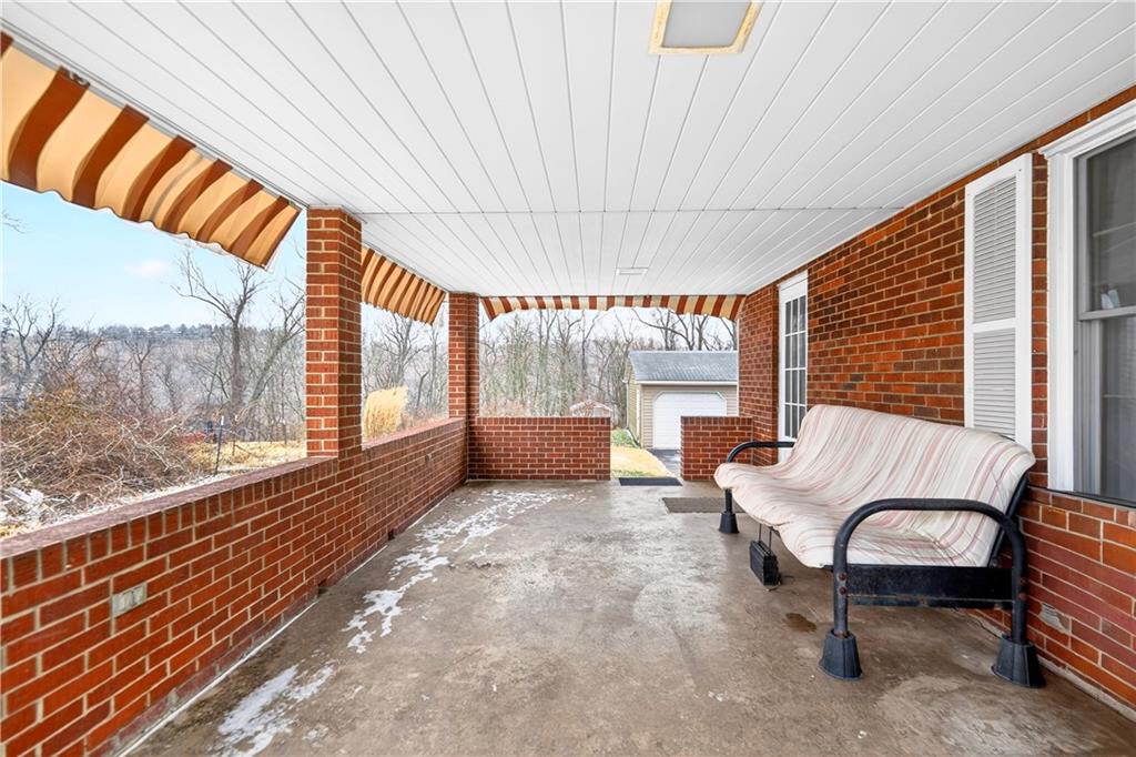 1008 Schweitzer Road McKeesport, PA 15135 - Photo 27 of 43 a balcony with furniture and large windows