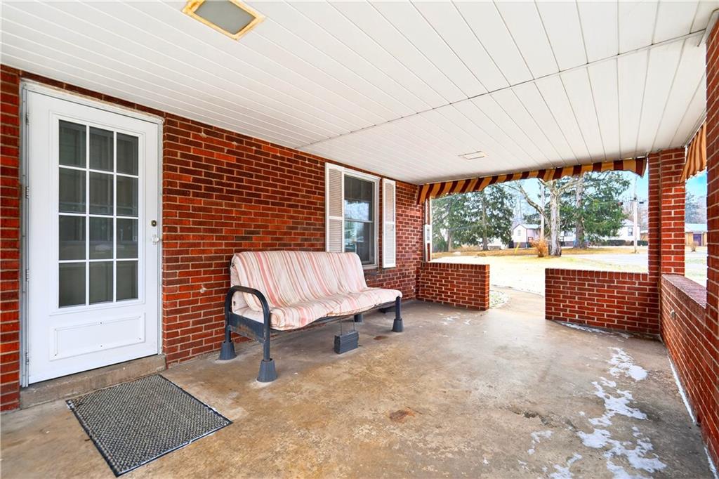 1008 Schweitzer Road McKeesport, PA 15135 - Photo 28 of 43 a view of a porch with furniture and a yard
