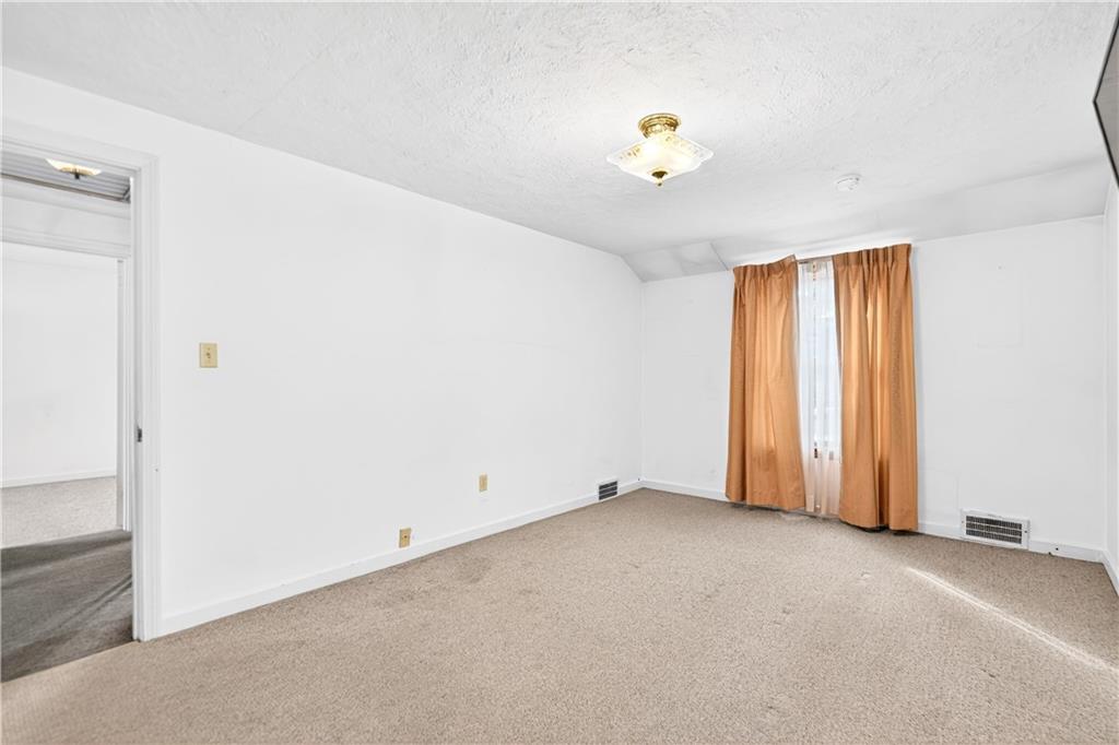 1008 Schweitzer Road McKeesport, PA 15135 - Photo 30 of 43 a view of an empty room with a window