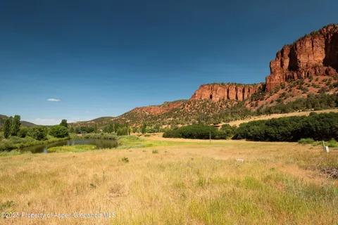 a view of mountain with large trees