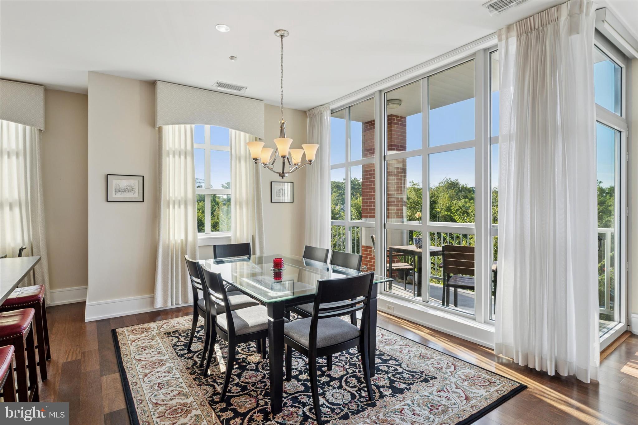 125 Iron Works Way Wayne, PA 19087 - Photo 14 of 32 a view of a dining room with furniture and wooden floor