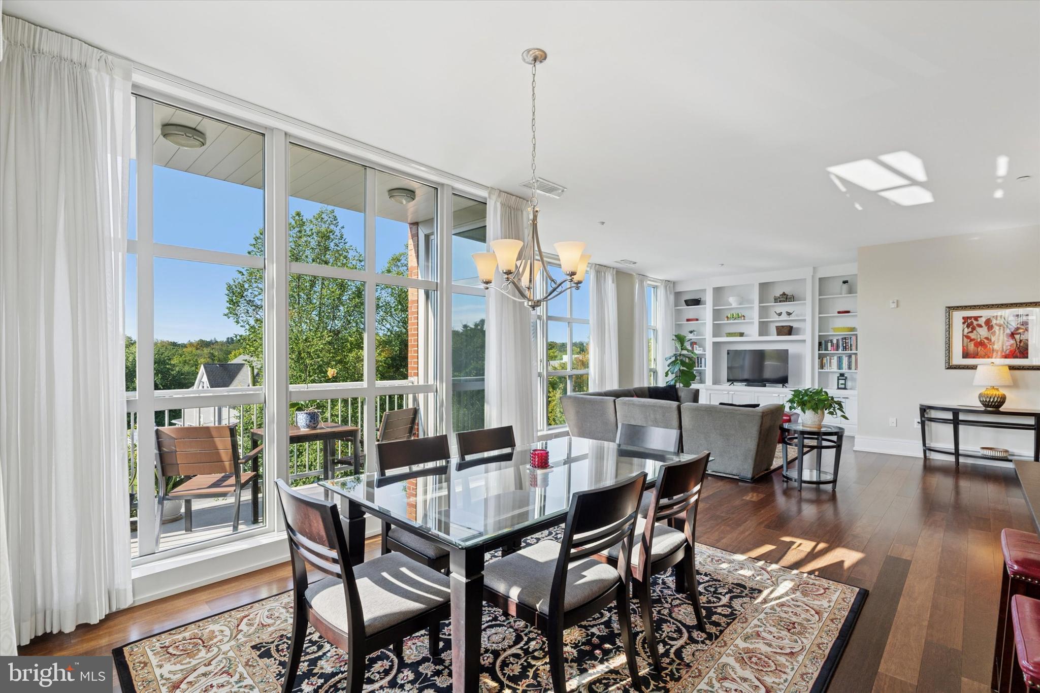 125 Iron Works Way Wayne, PA 19087 - Photo 16 of 32 a view of a dining room with furniture window and wooden floor
