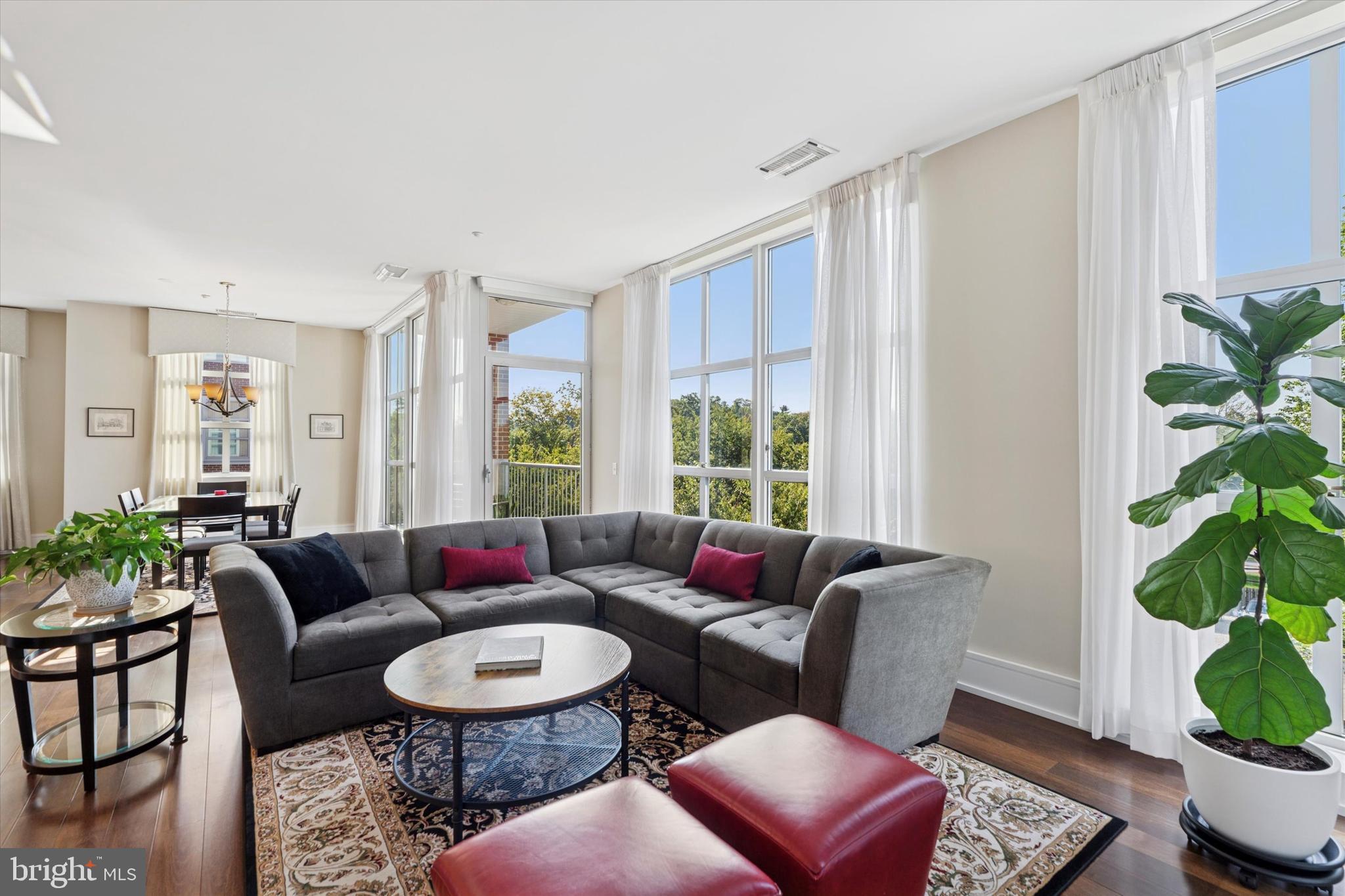 125 Iron Works Way Wayne, PA 19087 - Photo 19 of 32 a living room with furniture potted plant and a window