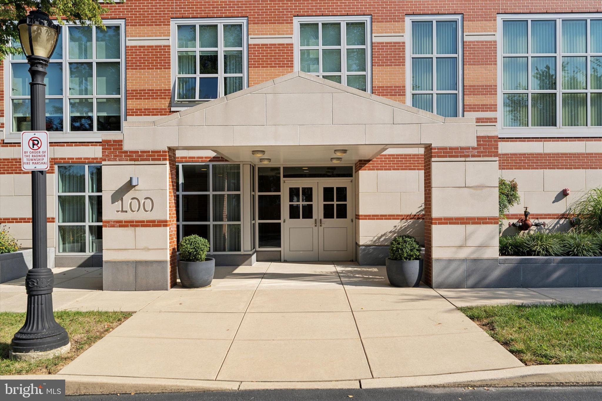 125 Iron Works Way Wayne, PA 19087 - Photo 2 of 32 a house with a potted plant in front of it