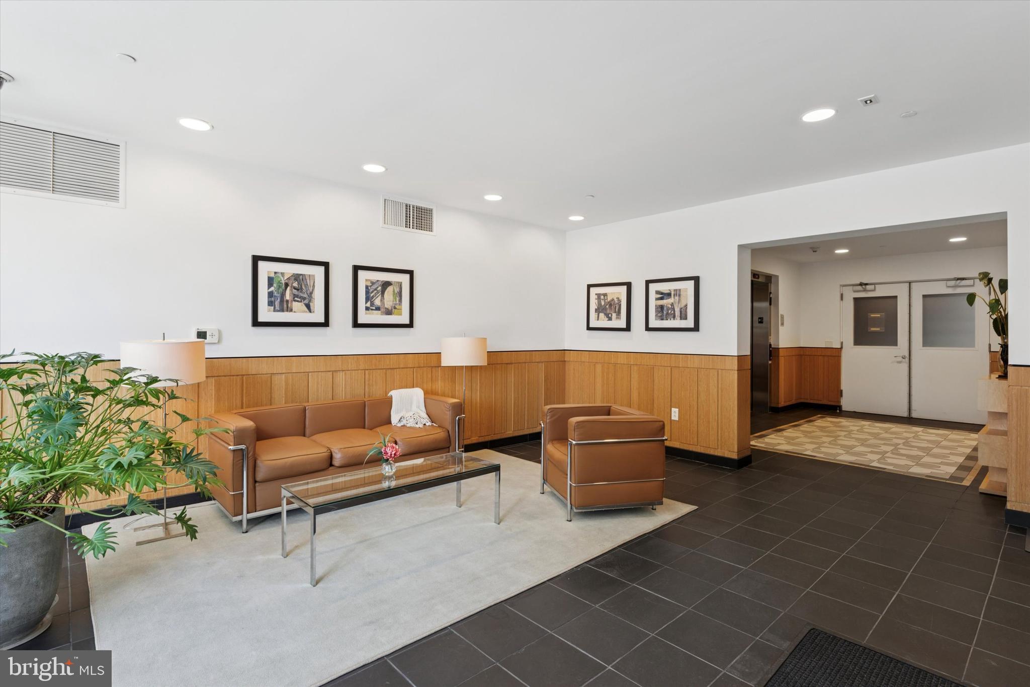 125 Iron Works Way Wayne, PA 19087 - Photo 30 of 32 a living room with furniture and view of kitchen