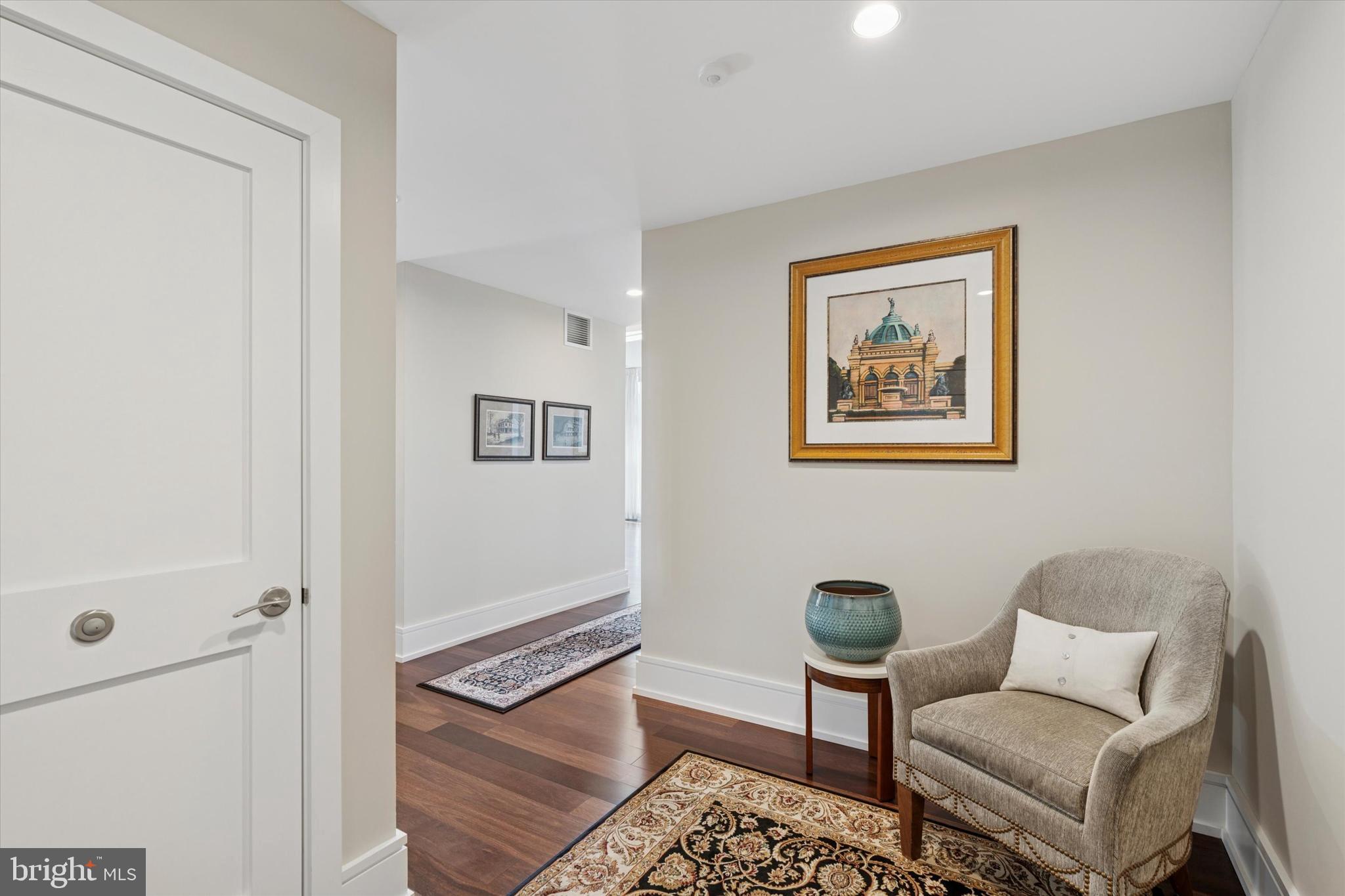 125 Iron Works Way Wayne, PA 19087 - Photo 4 of 32 a living room with furniture and a blue wall