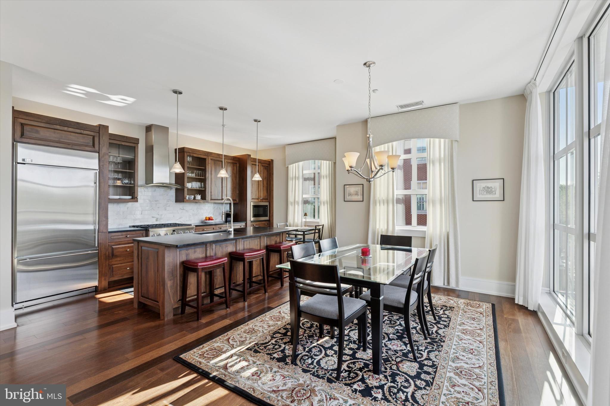 125 Iron Works Way Wayne, PA 19087 - Photo 8 of 32 a large kitchen with a table and chairs in it