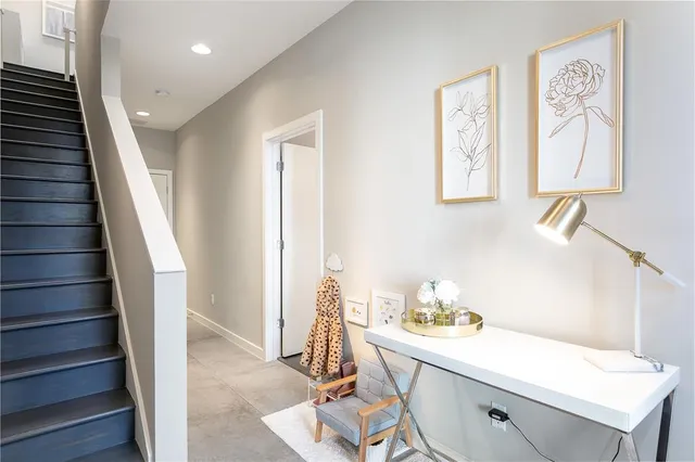 a view of entryway and hall with wooden floor
