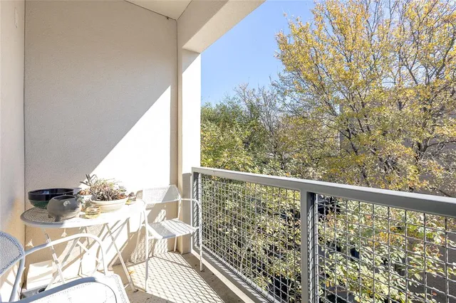 a spacious bathroom with a granite countertop sink a mirror and a