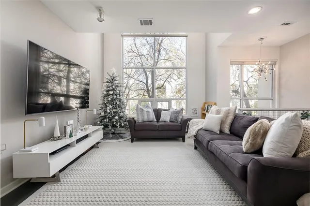 a living room with furniture and a large window