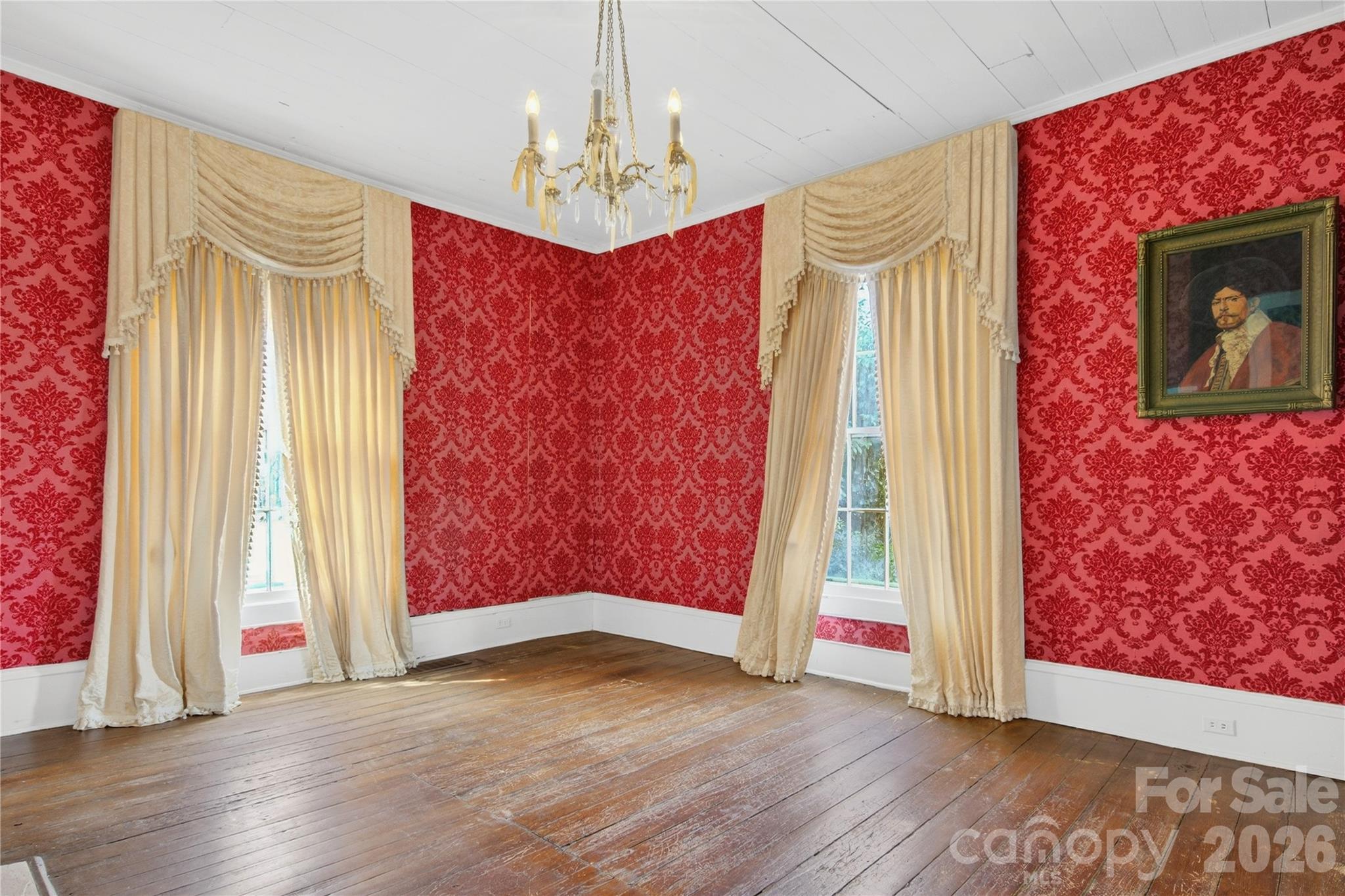 11124 Eastfield Road Huntersville, NC 28078 - Photo 12 of 42 a view of an empty room with wooden floor and a window