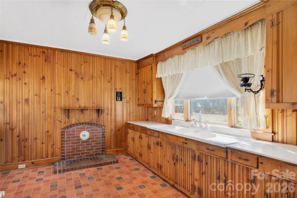 a bathroom with a sink a mirror and a shower