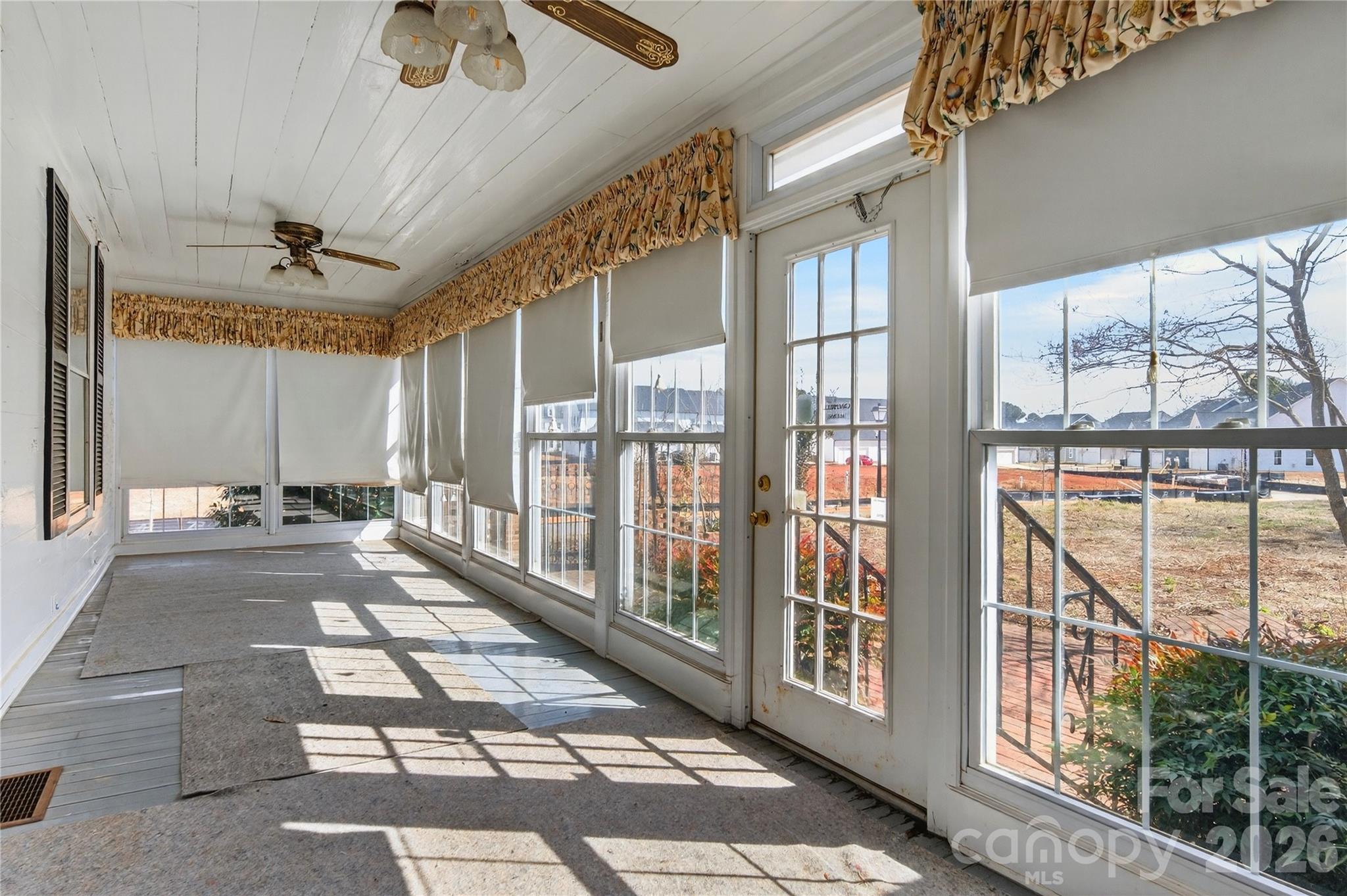 11124 Eastfield Road Huntersville, NC 28078 - Photo 20 of 42 a view of a porch with a table and chairs