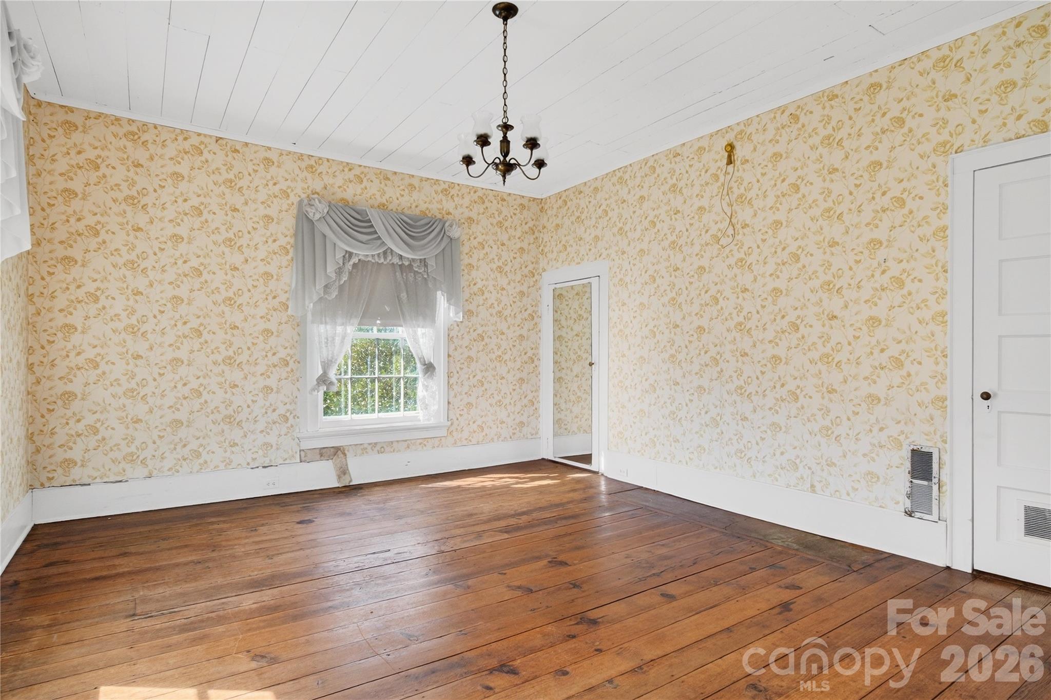 11124 Eastfield Road Huntersville, NC 28078 - Photo 23 of 42 a view of livingroom with window and wooden floor