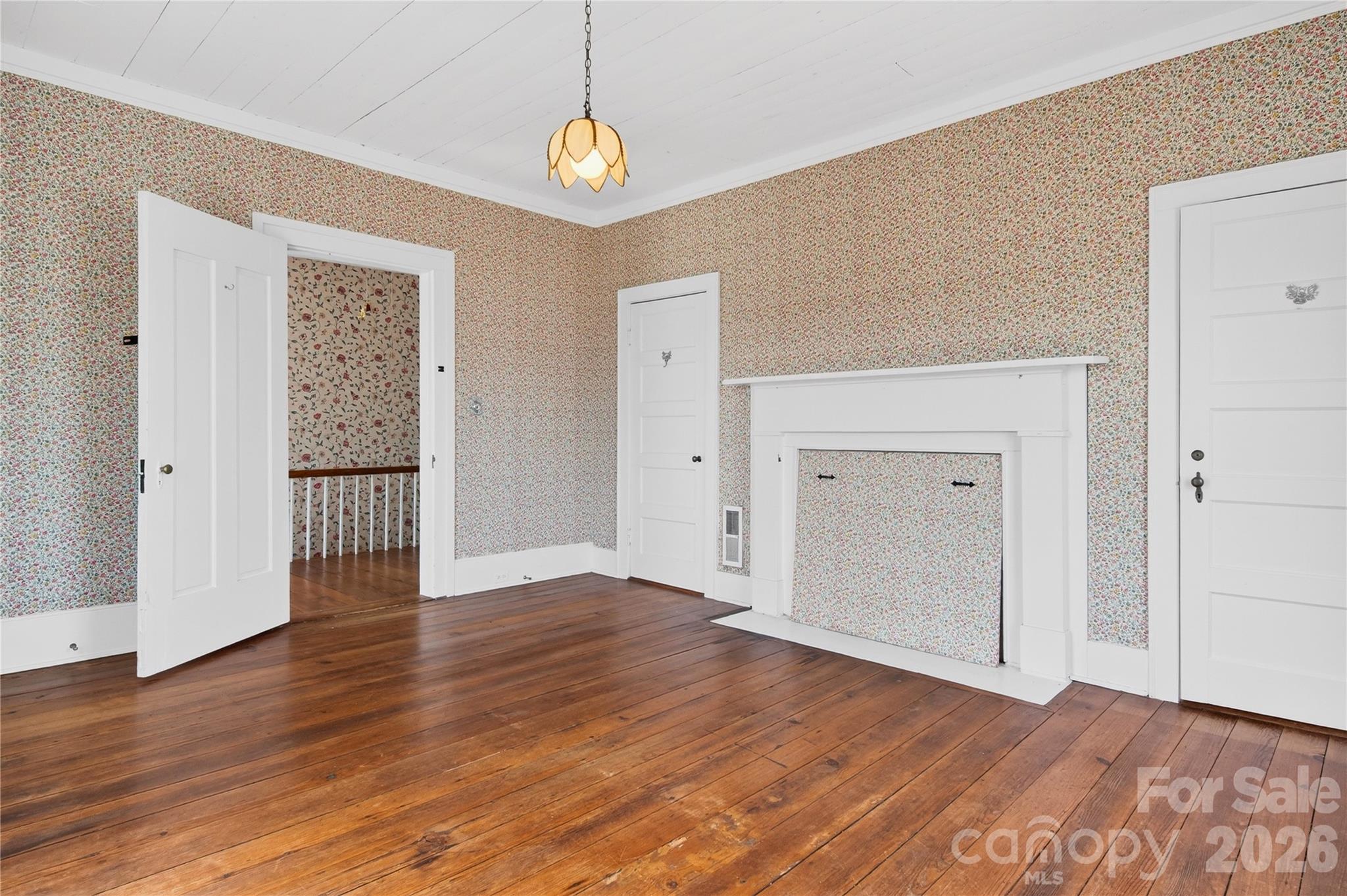11124 Eastfield Road Huntersville, NC 28078 - Photo 25 of 42 an empty room with wooden floor and windows