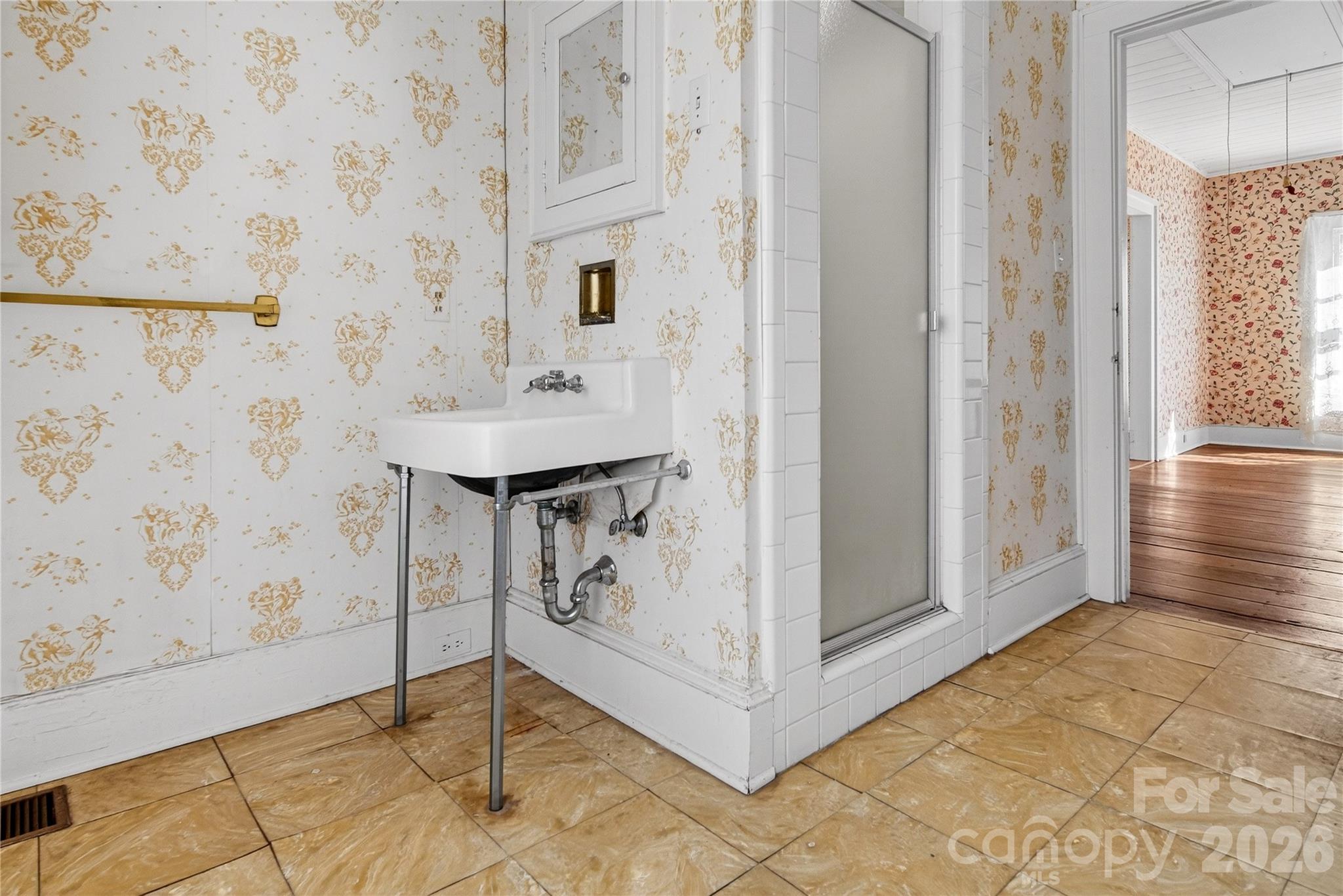 11124 Eastfield Road Huntersville, NC 28078 - Photo 31 of 42 a bathroom with a sink and mirror