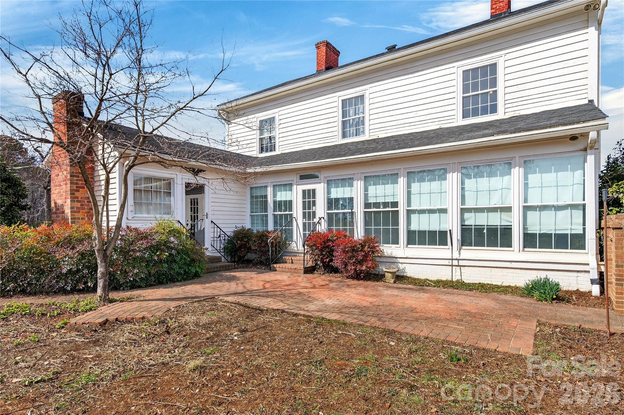 11124 Eastfield Road Huntersville, NC 28078 - Photo 32 of 42 a front view of a house with a yard and outdoor seating