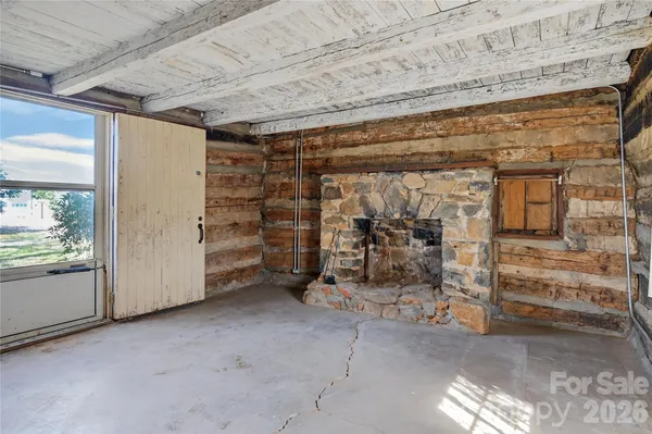 a view of an empty room and window