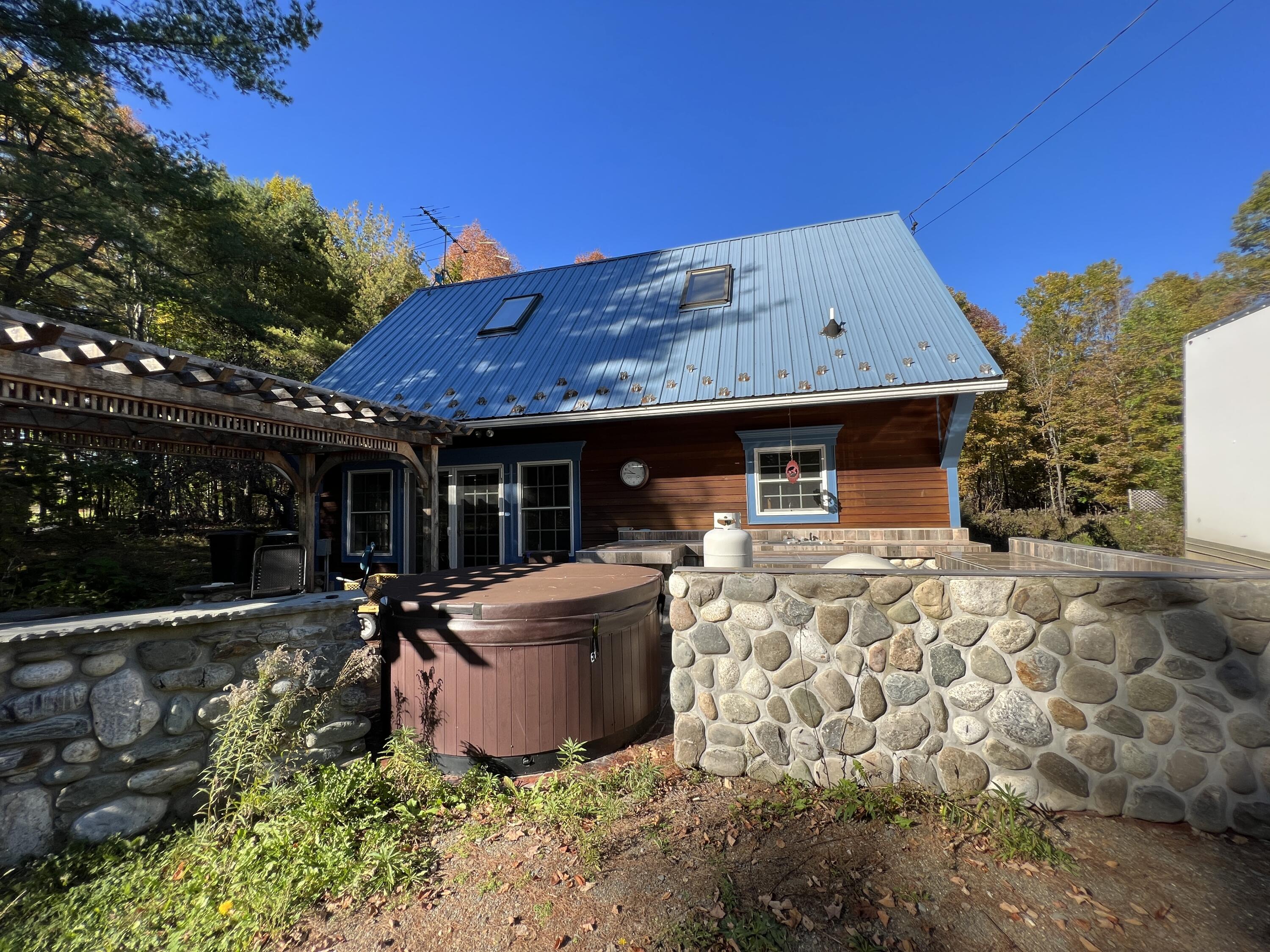 160 Cider Hill Road Exeter, ME 04435 - Photo 57 of 68 Rock Wall Surrounding Outdoor Kitchen