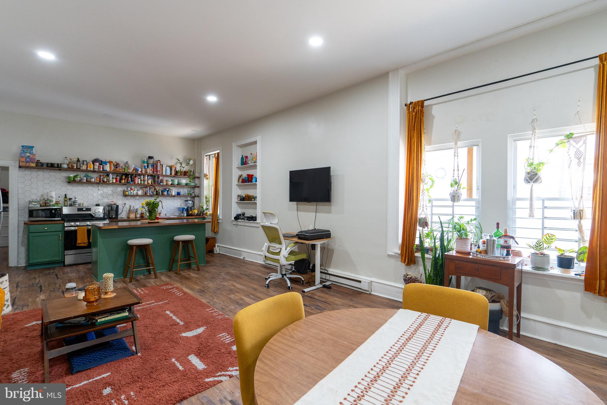1900 South 18th Street Philadelphia, PA 19145 - Photo 2 of 15 a living room with furniture and a flat screen tv