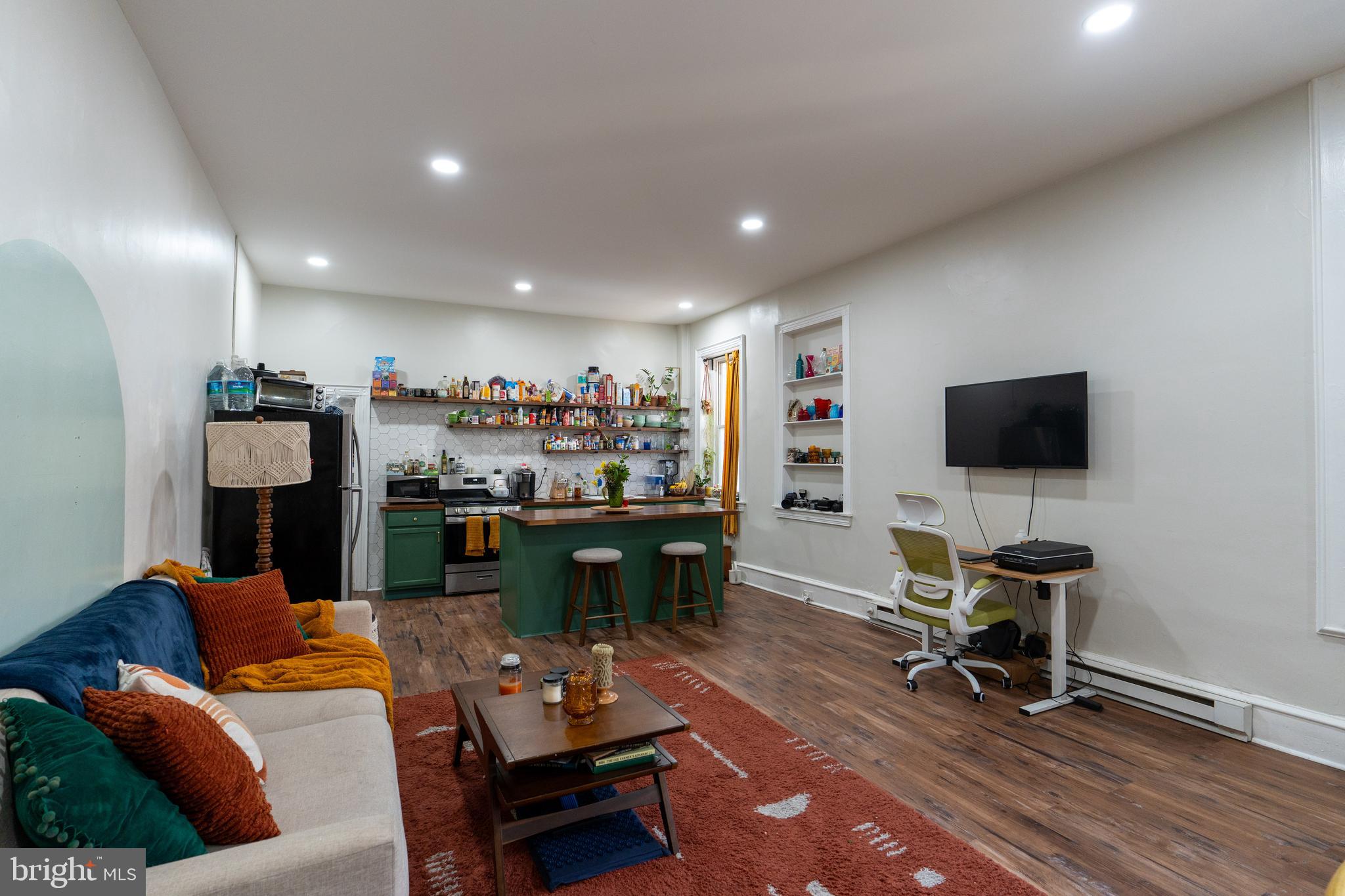 1900 South 18th Street Philadelphia, PA 19145 - Photo 7 of 15 a living room with furniture and a flat screen tv