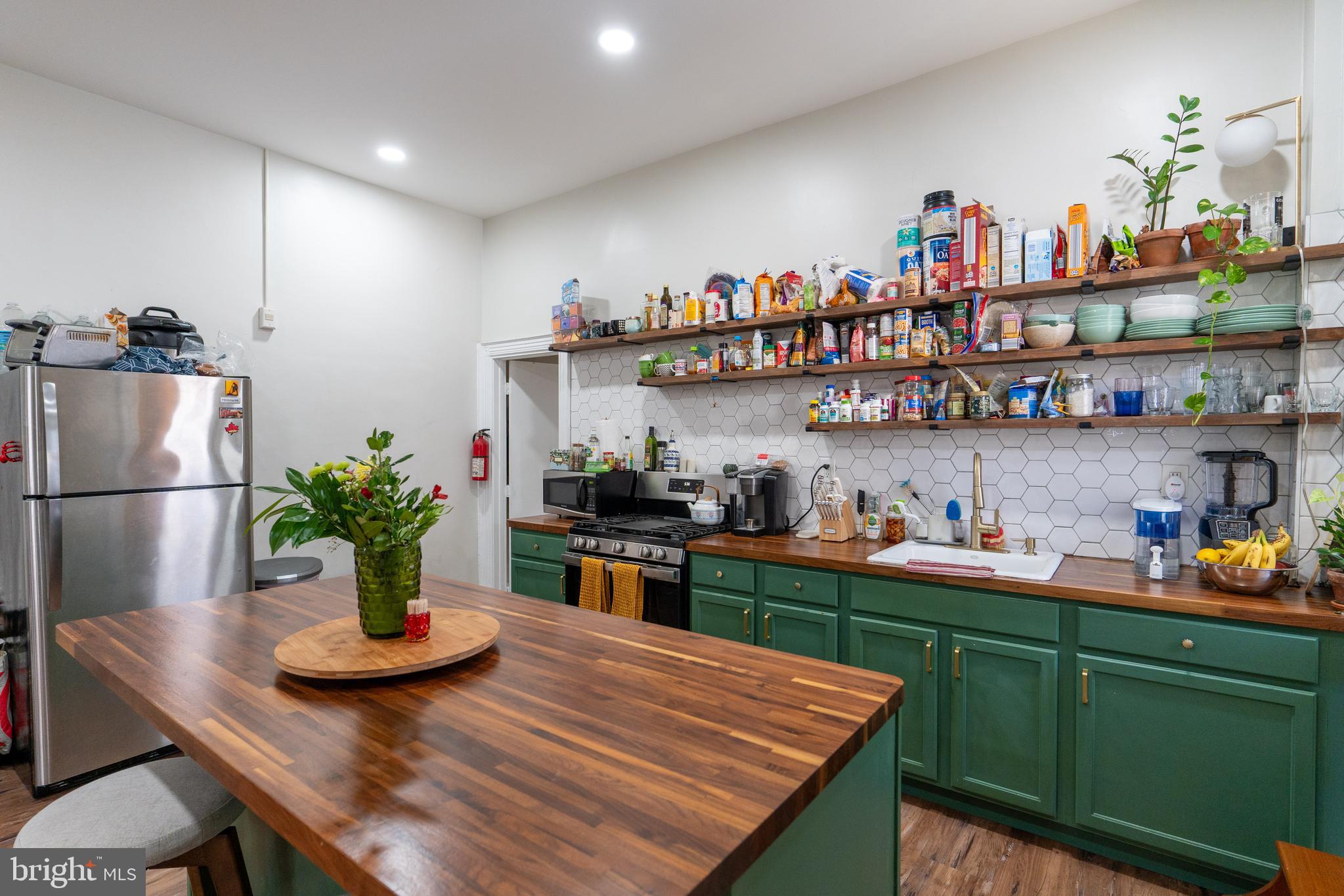 1900 South 18th Street Philadelphia, PA 19145 - Photo 10 of 15 a kitchen with a refrigerator and a wooden floor