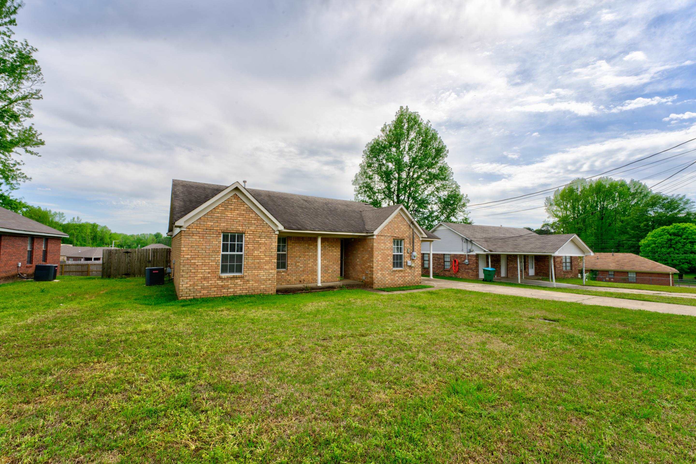 front view of a house with a yard