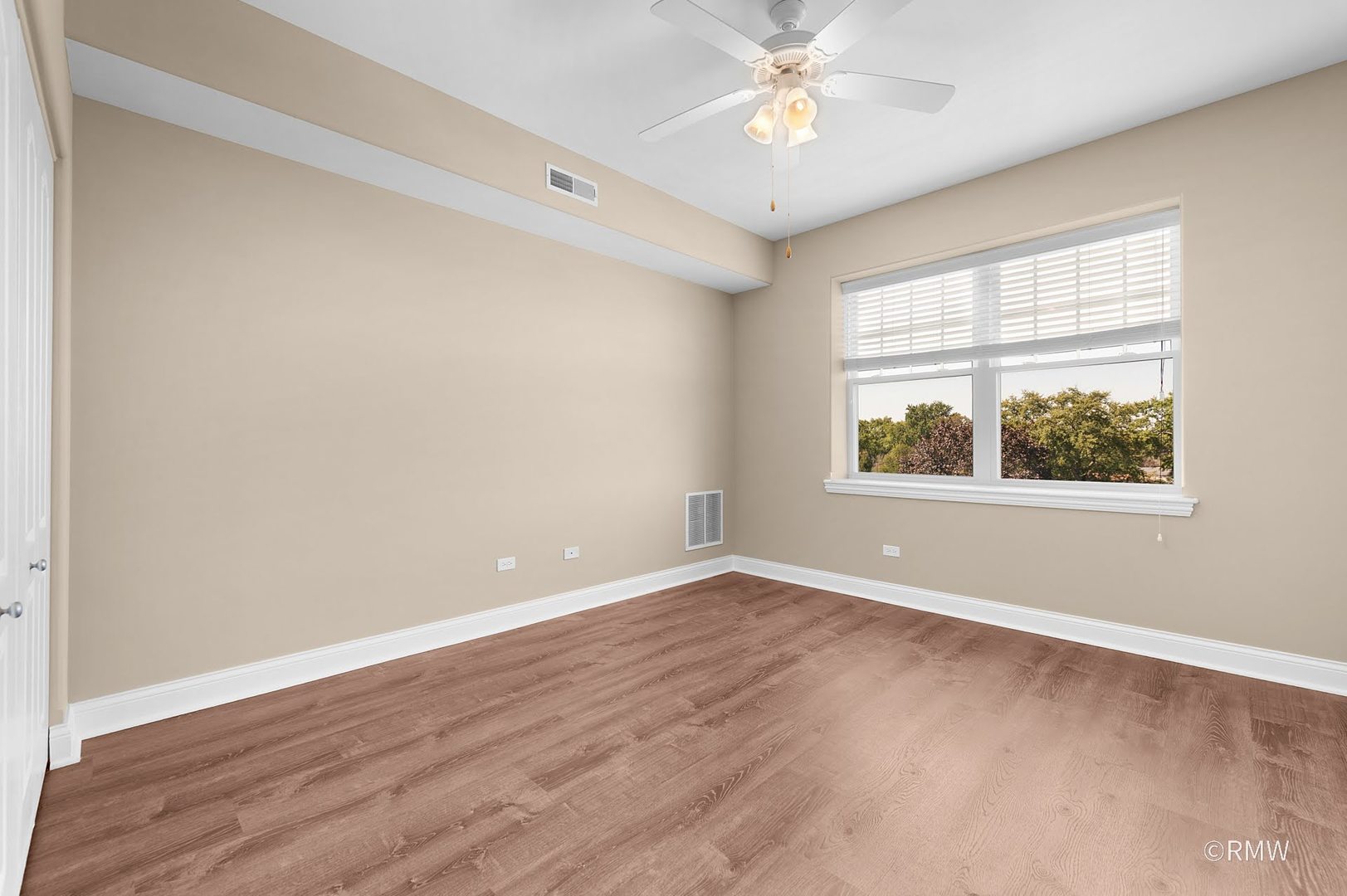 2 Itasca Place, Unit 419 Addison, IL 60143 - Photo 21 of 21 an empty room with wooden floor and windows
