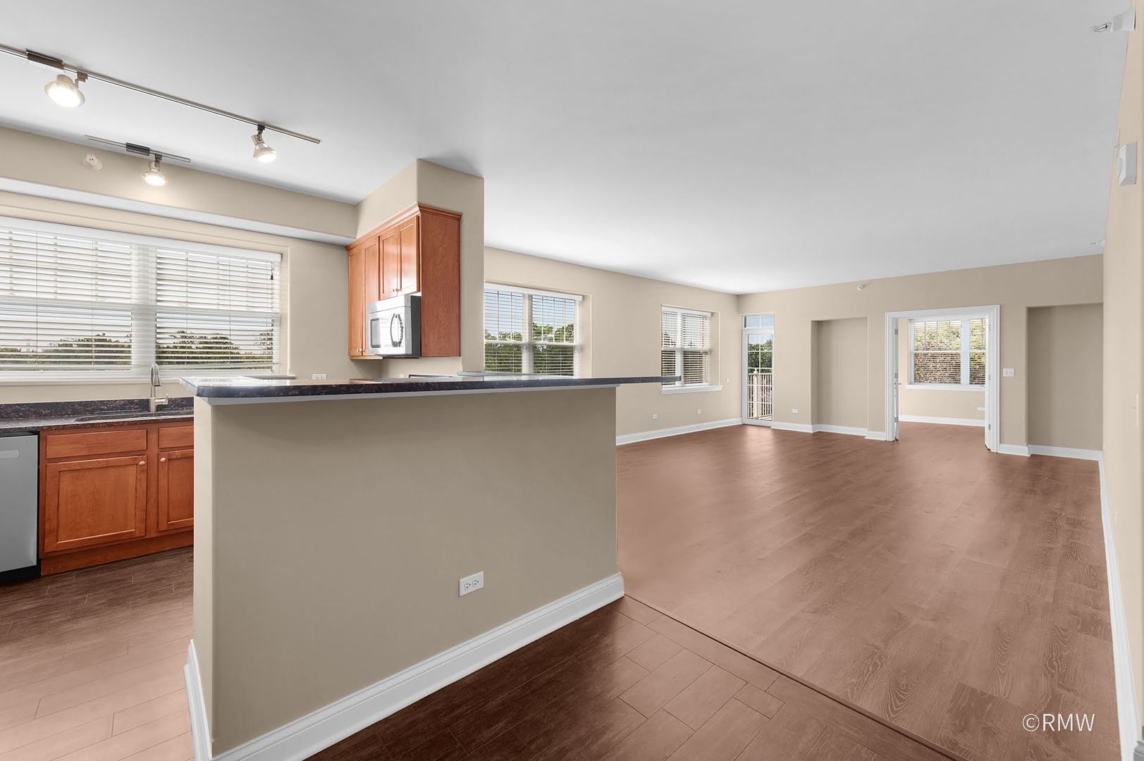 2 Itasca Place, Unit 419 Addison, IL 60143 - Photo 6 of 21 a kitchen with stainless steel appliances a sink a stove cabinets and wooden floor