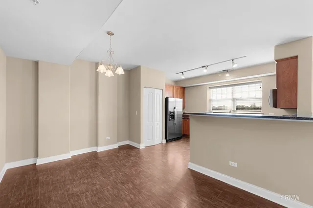 a view of a kitchen with a dishwasher and a window