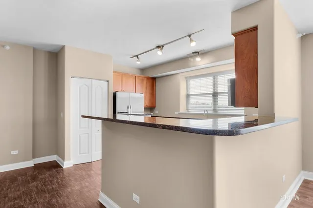 a kitchen with stainless steel appliances a sink and a window