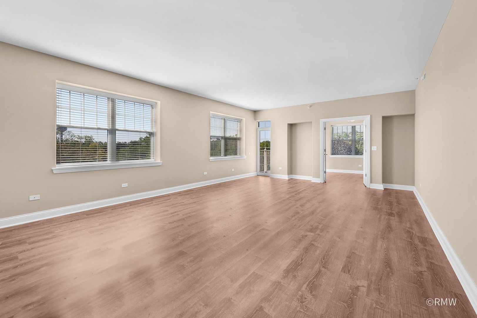2 Itasca Place, Unit 419 Addison, IL 60143 - Photo 10 of 21 a view of an empty room with wooden floor and a window