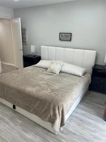 a large white bed in a white room