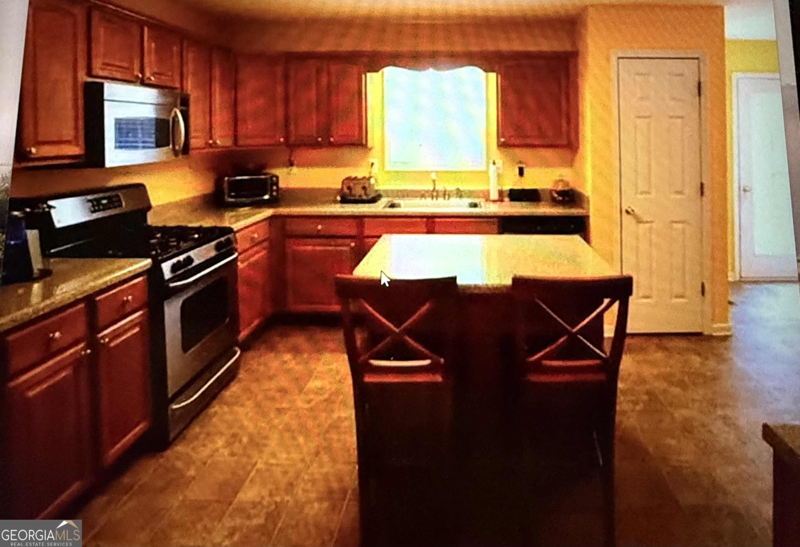 178 Hunters Mill Drive Hiram, GA 30141 - Photo 6 of 13 a kitchen with a sink a stove and cabinets