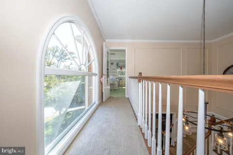a bedroom with a bed and a wooden floor