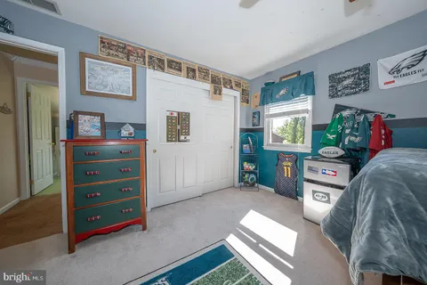 a bathroom with a granite countertop sink mirror and shower