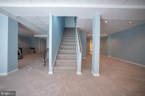 a view of a livingroom with furniture and a window