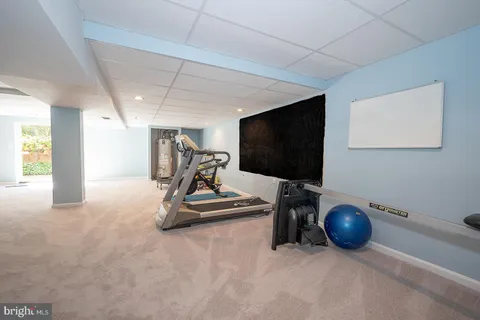 a view of a livingroom with furniture and a flat screen tv