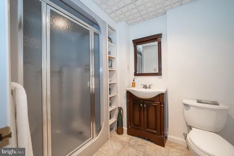 a view of an empty room with a bathroom