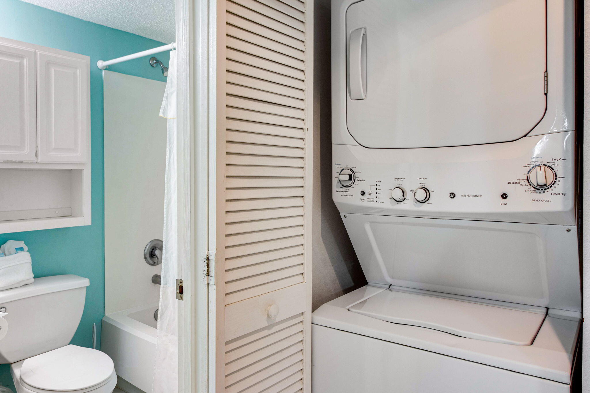 970 Highway 98, Unit 303 Destin, FL 32541 - Photo 38 of 42 a white toilet sitting next to a bathroom sink