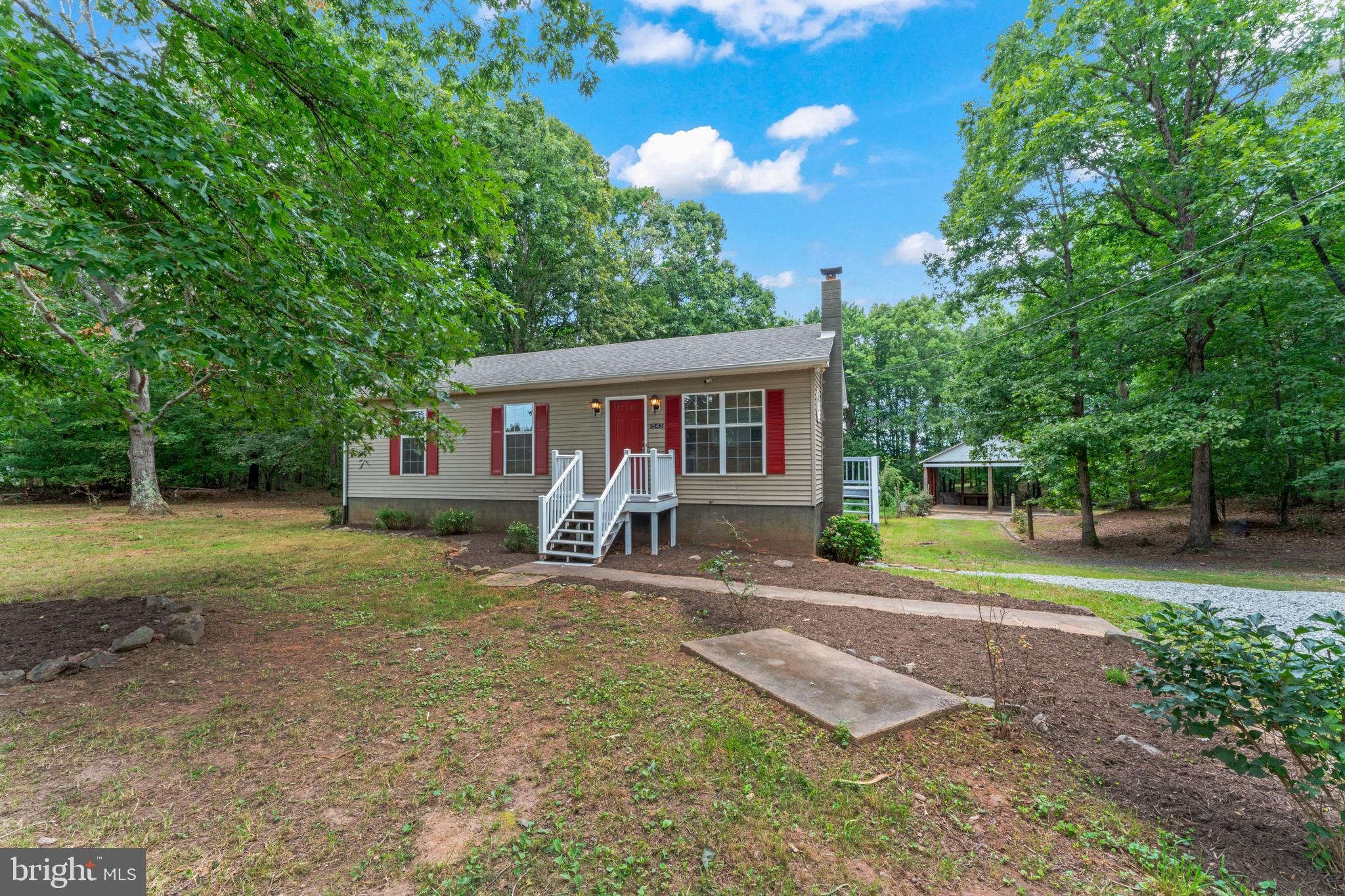 1543 Vawter Corner Road Louisa, VA 23093 - Photo 1 of 43 a view of a house with a yard porch and sitting area